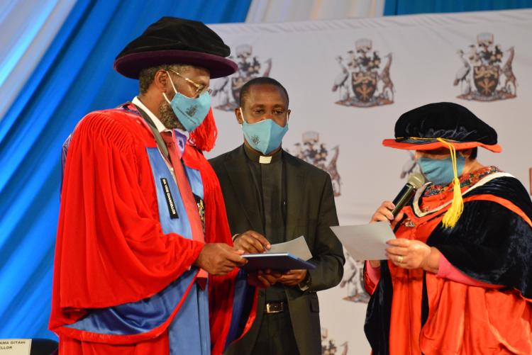 The Vice Chancellor receiving the Universities standards and guidelines, 2014